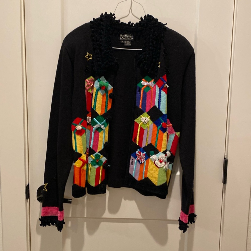 Berek Christmas Sweater.  Fringe around‎ neck.  Presents on front of sweater.